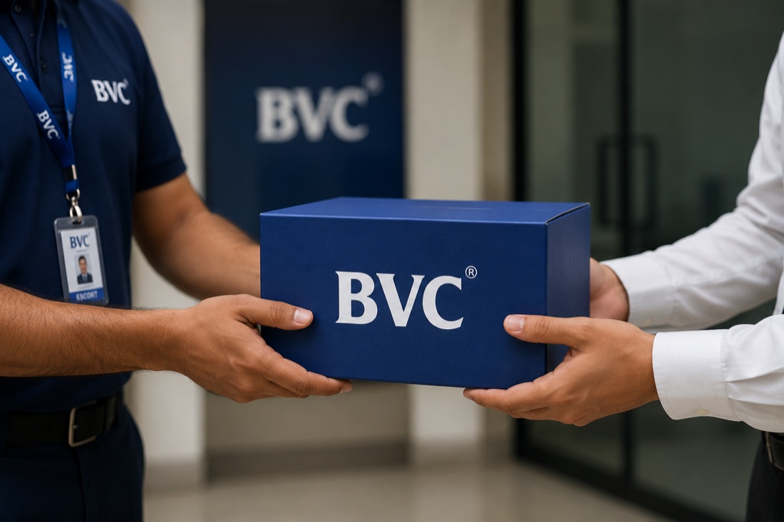 BVC escort with ID badge handing a sealed BVC box to a trader at a bourse office